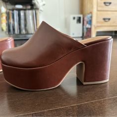 Never Worn!! Doesn’t Fit Me Retro Synthetic Heels For Fall, Trendy Brown Mules For Spring, Trendy Brown Heels With Sculpted Heel, Retro Brown Synthetic Heels, Brown Mules With Stacked Heel For Party, Brown Faux Leather Mules For Fall, Brown Stacked Heel Party Mules, Retro Faux Leather Heels For Spring, Brown Mules With 4-inch Heel For Spring