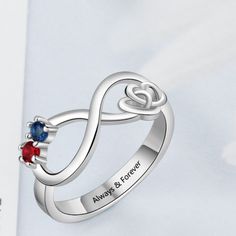 Personalized Infinity Promise Ring For Women has an infinity shape in the center along with two hearts knotted each other in a way symbolizing promise, making it a perfect promise ring for women. It also has two birth stones on it and a personalized message can be engraved inside the ring. Features: Color: Silver Material: Silver Style: Personalized Size: Available Size: US - 5/6/7/8/9 Weight: 2g Size Chart: Size Circumference(mm) UK,Europe & Australia CN/SG/JP Switzerland 5 49.3 J 1/2 9 9 6 51. Mother's Day Infinity Adjustable Rings, Adjustable Infinity Promise Ring, Adjustable Infinity Ring For Mother's Day, Personalized Adjustable Infinity Rings, Infinity Birthstone Ring For Anniversary, Infinity Promise Ring For Valentine's Day, Infinity Promise Rings For Mother's Day, Infinity Promise Jewelry With Birthstone, Infinity Promise Ring With Birthstone