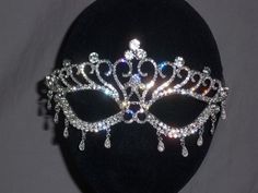 Bright clear rhinestones make up this beautiful mask with dangles. Perfect for any festive occasion. The mask is 7 1/2 inches long across the face and 3 inches tall in the center. Returns & exchanges I ship five days a week, Monday through Friday, via USPS First Class Mail. Youll Silver Rhinestone Eye Mask For Masquerade, Silver Rhinestone Eye Masquerade Mask, Wedding Masquerade Mask With Rhinestones, Elegant Silver Masquerade Mask For Wedding, Silver Rhinestone Masquerade Mask For Carnival, Rhinestone Masquerade Mask For Mardi Gras Carnival, Elegant Rhinestone Masquerade Mask, Mardi Gras Masquerade Mask With Rhinestones For Carnival, Mardi Gras Party Masks With Rhinestones