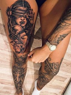 a woman's legs with tattoos on them