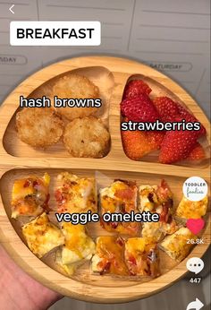 a person holding a wooden plate with food on it and the words breakfast hash browns strawberries veggie omelette