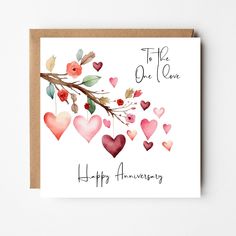 an anniversary card with watercolor hearts and branches