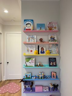 there are many books on the shelves in this child's room