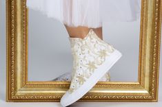 Now all our wedding sneakers with free express shipping upgrade to USA, Canada and Europe : 2-4 business days transit time always.You can have your shoes pretty fast with guranteed transit times by DHL express. New faster production time.Everything is shipped in 1-2 weeks. Made with love for your wedding day by Lovin Bridal - More Wedding shoes at our shop : http://lovincollection.etsy.com High Top Wedding Sneakers For Bride, Bridal Trainers With Flowers, Bridesmaid Tennis Shoes, Converse High Top It's the bride's prerogative to wear the comfiest wedding shoes. If you're set on heels then one option is to have your High Top Lace Bridal Chuck Taylor as a second pair of bridal shoes to change into for the reception. There are so many options for your wedding sneakers - go for white or ivory Gold Embroidered Wedding Shoes For Reception, Festive Gold Wedding Shoes With Gold Embroidery, White And Gold Converse, Wedding Shoes With Gold Embroidery, Custom White High-top Wedding Sneakers, Wedding Sneakers For Bride, Comfy Wedding Shoes, Bridal Sneakers, Wedding Converse