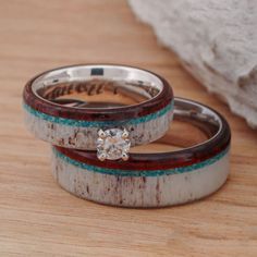 two wedding bands with a diamond on them