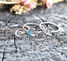 "Opal Moon & Star Ring: -Solid .925 sterling silver -Face height 8mm on 2mm width ring band -Color choice Pink or blue opal with 5 point star, or white opal with North star. -Comfortable and easily stackable! -Available in US sizes 3-13 with half sizes.  More rings here: https://www.etsy.com/shop/AWildViolet?ref=seller-platform-mcnav&section_id=13958646 Looking for a last minute or unique Christmas gift? Visit our \"READY TO SHIP\" section here, ships out in one business day https://www.etsy.com Celestial Stackable Promise Rings, Silver Star-shaped Celestial Midi Rings, Celestial Style Stackable Rings As Gift, Nickel-free Celestial Moon Ring, Adjustable Moon Shaped Celestial Rings, Celestial Silver Star Midi Rings, Adjustable Moon-shaped Celestial Rings, Silver Moon Shaped Celestial Crystal Ring, Silver Moon Phase Crystal Ring