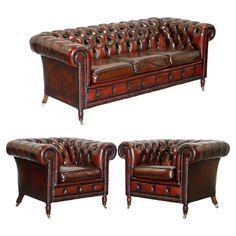 a set of three leather couches with wooden legs