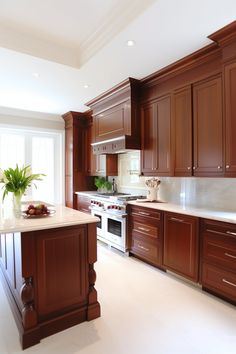 a large kitchen with wooden cabinets and white counter tops, along with a center island