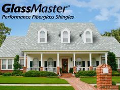 a house with the words glassmaster performance fiberglass shingles in front of it