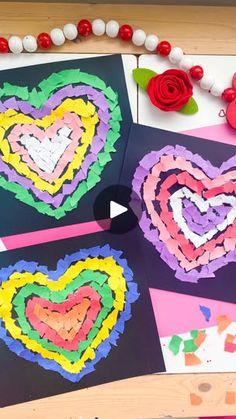 paper hearts are arranged on the table for valentine's day crafting activity with flowers and beads