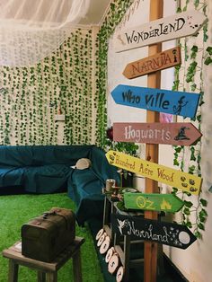 a living room filled with furniture and lots of signs