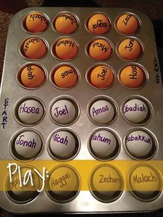 a muffin tin with the words play written on it, and an egg tray