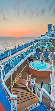 the deck of a cruise ship at sunset