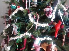 a christmas tree decorated with ornaments and candy canes