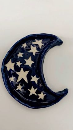 a ceramic crescent with stars on it