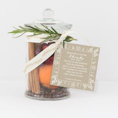 a jar filled with cinnamons, apples and spices next to a tag that says something special