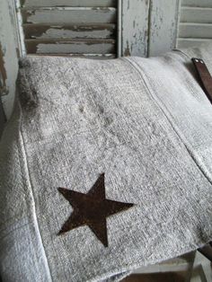 an old chair with a brown star on it