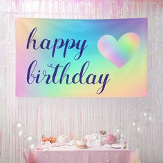 a happy birthday banner hanging over a table