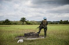 a soldier is standing in the middle of a field