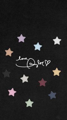 a black background with stars and the word love written in cursive writing on it