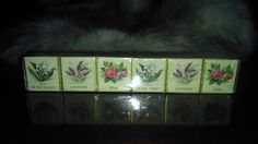 four bars of soap with flowers on them