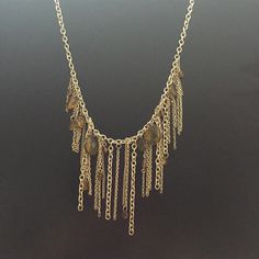 Express Gold Chain Fringe Necklace With Neutral Bead Accents. Metal Dangle Chain Necklace Costume Jewelry, Metal Pendant Chain Necklace With Beaded Chain, Silver Dangle Necklaces With Gold Chain, Beaded Chain Metal Pendant Necklace, Metal Beaded Chain Dangle Necklace, Metal Beaded Chain Pendant Necklace, Gold Crystal Dangle Necklaces With Beaded Chain, Gold Chain Necklace With Dangling Beads, Gold Chain Metal Necklace With Dangle