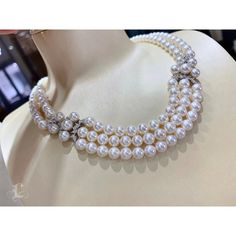 Highlight: Beautiful Natural White Akoya Pearls Product Information OriginJapan MaterialAkoya Pearl, 18k White Gold, and Diamond Clasp DimensionsNecklace Length 45 cm Pearl Shaped: Round Size: 6-7.5 mm Quality: AAA Nacre: Very Thick Color: White Luster: Very High Accessories Metal: 8.5 g 18k White Gold Other: 1.60 ct of SI Quality Natural Diamond Luxury Pearl Necklace With 17 Jewels, Luxury Akoya Pearl Necklace For Evening, Luxury Round Bridal Necklace For Evening, Luxury High Luster Necklaces For Formal Occasions, Luxury Single Strand Pearl Necklace, Luxury High Luster Pearl White Pearl Necklace, Luxury Pearl Chain Necklace For Anniversary, Luxury High Luster Pearl White Necklace, Luxury Pearl Necklace With Diamond Accents