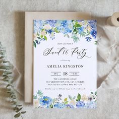 a blue and white floral bridal party card on top of a piece of paper