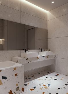 a bathroom with two sinks and mirrors in it