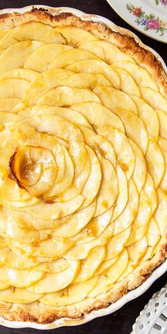 an apple pie is shown on a table