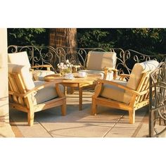 an outdoor table and chairs on a patio