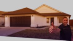 a man giving the thumbs up in front of a house