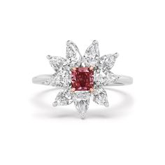 This mesmerizing ring is adorned with a radiant deep pink diamond, expertly set amidst a delicate floral-inspired design. Each petal of the intricate floral motif is meticulously crafted to enhance the brilliance of the central diamond, creating a captivating display of light and color. The rich hue of the deep pink diamond exudes warmth and intensity, making it a truly exceptional centerpiece. 0.52CT Radiant Fancy Deep Pink Diamond - SI1 Clarity, GIA #1172264899 9 x 0.30CT Pear Shape Natural Wh Luxury Pink Flower Ring For Anniversary, Luxury Pink Flower Ring, Luxury Pink Flower Shaped Ring, Floral Ring, Deep Pink, Pink Diamond, The Deep, Pear Shape, Floral Motif