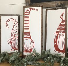 three framed art pieces with christmas decorations on them