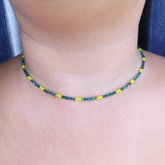 Beautiful shiny choker necklace with green and yellow crystal beads. This beautiful necklace made from 1mm green and yellow crystal beads, and closes with a stainless steel clasp and a stainless steel adjustable chain (2inches). SIZE This necklace is available in 2 different sizes: (14inch-16inch) - (6inch-18inch). Please contact with me if you prefer a different size. Every item we sell is handmade and handcrafted with love and care. All PolysJewelryArt jewelry arrived in a beautiful box or pou Yellow Tiny Beads Choker For Gift, Yellow Tiny Beads Choker As Gift, Adjustable Yellow Choker With Tiny Beads, Green Tiny Beads Choker Necklace, Green Choker With Tiny Round Beads, Adjustable Green Choker With Tiny Beads, Green Beaded Choker Jewelry, Adjustable Green Crystal Necklace With Beaded Chain, Green Minimalist Beaded Necklace With Tiny Beads