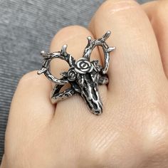 This Deer skull ring features a striking design, with a deer skull carefully crafted onto a textured gothic-style ring. Its eye-catching style makes it the perfect accessory for a daring fashion statement. Material : 316 Stainless steel Finish: Anti-Silver /Matt finish with heavy oxidation Size: 23mm long X 26mm wide Ships in a gift box Oxidized Ring, Deer Skull, Deer Skulls, Gothic Rings, A Deer, Skull Jewelry, Animal Skulls, Skull Ring, Gothic Style