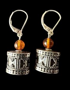 Exquisite Bali beads paired with amber, dangling elegantly from lever back earrings measuring 1/2 inch in length. Amber Dangle Earrings With Lever Back, Amber Dangle Earrings With Lever Back Ear Wires, Henderson Nv, Jewelry Earrings Dangle, Bali, Dangle Drop Earrings, Amber, Dangle Earrings, Jewelry Earrings