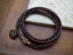 This double strand, triple wrap leather bracelet features an Om charm and a solid antiqued brass magnetic clasp. The secure clasp (17 mm) is great for easy on and off and serves as an industrial looking focal point. This bracelet is sure to be one of your favorites. This Bracelet is made with two strands fine imported quality 3mm leather cord. All dyes used in our leather are certified 100% Lead-Free and meet all requirements of the German Goods Ordinance, REACH (European Union), RoSH (U.K.), an Men Leather Bracelet, Om Bracelet, Om Charm, Triple Wrap Bracelet, Leather Bracelets Women, Bracelet Men, Bracelet Leather, Bracelet Women, Mens Leather Bracelet