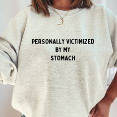 My Tummy Hurts, Tummy Ache Shirt, Chronic Illness T-Shirt or Crewneck, IBS Tees , Tummy Hurts Sweatshirt, Funny Tees , Funny Gift for Her I am currently out the Oatmeal Heather Sweater - to purchase in a different color please go here: https://www.etsy.com/ca/listing/1581474663/my-tummy-hurts-tummy-ache-shirt-chronic This soft and relaxed sweatshirt has a loose fit for a comfortable feel. CARE Machine wash: warm (max 40C or 105F) Do not iron directly on the print ABOUT We are a small business of Personally Victimized By My Stomach, My Tummy Hurts Shirt, My Tummy Hurts But Im Brave, Funny Sweatshirts Quotes, Sweatshirt Design Ideas, Heather Sweater