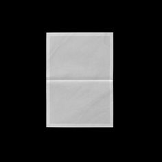 an empty white paper bag on a black background