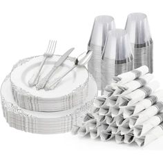 there are many silverware and forks on the table set up for a party or celebration