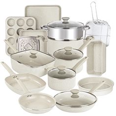 an assortment of kitchenware including pots and pans