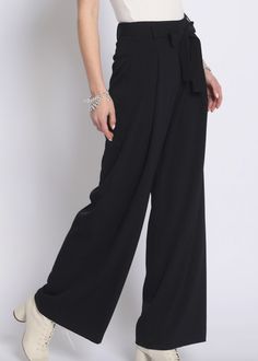 Super chic black wide leg pants with tie waist detail. Excellent quality material. Runs true to size. Model is wearing size small. Solid Wide Leg High Waist Pants With Tie Waist, Solid Wide Leg Pants With Tie Waist, High Waist Wide Leg Pants With Tie Waist, Chic Belted Full Length Pants, Versatile Belted Wide Leg Pants, Versatile Black Wide Leg Pants For Night Out, Elegant Wide Leg Pants With Tie Waist For Spring, Elegant Spring Wide Leg Pants With Tie Waist, Chic Evening Dress Pants With Belt Loops