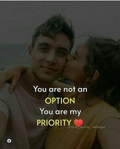 a man and woman kissing with the caption you are not an option, you are my priority