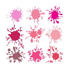 different colored paint splatters on white paper with one red and one pink color