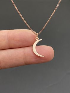 "18k Rose Gold Vermeil Crescent Moon Necklace Small, Minimalist and Dainty Moon Necklace Measurement: pendant height is 22mm (0.87\") including bail and 8mm (0.31\") wide Metal: All components are made from 18k Rose gold plated sterling silver (vermeil) Choose Chain Length At Checkout Please feel free to Convo me with any questions before purchasing. You can find other charm jewelry in my shop here https://www.etsy.com/shop/LinksAndStones?ref=seller-platform-mcnav&section_id=24389019 Please Rose Gold Moon Phase Round Pendant Necklace, Minimalist Rose Gold Moon-shaped Jewelry, Rose Gold Moon Phase Necklace, Rose Gold Necklace With Round Moon Charm Pendant, Rose Gold Crescent Necklace With Moon Charm, Rose Gold Moon Necklace With Moon Charm, Rose Gold Moon Charm Necklace, Rose Gold Crescent Moon Charm Necklace, Minimalist Rose Gold Necklace With Moon Charm