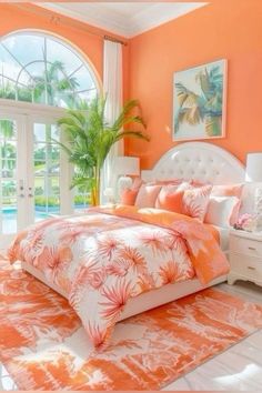 an orange and white bedroom with palm trees in the window sill, pink bedding