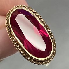 This Vintage Filigree Ring Is A Stunning Piece Of Jewelry That Will Add A Touch Of Elegance To Any Outfit. The Ring Is Made Of 10k Gold And Features A Beautiful Oval-Shaped Red Stone That Is Sure To Catch The Eye. The Deco Geometric Cut Of The Stone Adds A Unique Touch That Makes This Ring Truly Special. The Ring Is A Size 6 And Is Designed For Women. It Is Perfect For Those Who Appreciate Vintage And Antique Jewelry, And Would Make A Great Addition To Any Collection. The Brand Of The Ring Is Filigree, And It Is Made Of High-Quality Materials That Ensure Its Durability. This Ring Is A Must-Have For Anyone Who Wants To Add A Touch Of Vintage Charm To Their Wardrobe. Filigree Jewelry, Ladies Ring, Gold Filigree, Filigree Ring, Red Stone, 10k Gold, Womens Jewelry Rings, The Eye, Vintage Charms