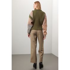 Green patchwork knit (54% Virgin Wool 33% Polyester 13% Acrylic). Sweater. Long sleeves. Crewneck. Pull on. 17" from shoulder to hemline. Imported. Patchwork Turtleneck Sweater For Fall, Fall Patchwork Turtleneck Sweater, Beige Patchwork Sweater For Layering, Beige Patchwork Tops For Work, Fitted Knit Sweater With Patchwork, Color Block Tops For Winter Workwear, Color Block Tops For Workwear In Winter, Casual Workwear Patchwork Cardigan, Casual Patchwork Cardigan For Work