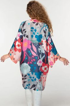 This elegant Malini kimono, by our friends at Sevya Handmade, is crafted with 100% Cupro material for a luxurious yet sustainable option. Its lightweight, breathable composition gives it a similar silk-like feel while significantly reducing care needs. Free-size designed with a floral pattern, this fair-trade garment will provide you with long-lasting comfort. Sevya, derived from Sanskrit, translates to "caring through service". Dedication to preserving India's unique arts and cultures is shown Silk V-neck Kimono For Daywear, Spring Satin V-neck Robe, Silk V-neck Summer Robe, Spring Loungewear Kimono, Spring Vacation Sleepwear With Kimono Sleeves, Spring Long Sleeve Silk Sleepwear, Spring V-neck Satin Robe, Satin V-neck Robe For Spring, Spring Silk Kimono With Kimono Sleeves